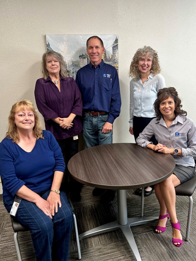 Photo cutline: KPUB Finance Department, L to R: Accounting Supervisor, Jill Cook; Accounts Payable Clerk, Laura Robinson; Purchasing Agent, Damon Richardson; Director of Finance, Amy Dozier; and Property Accounting Clerk, Nikole Lee.