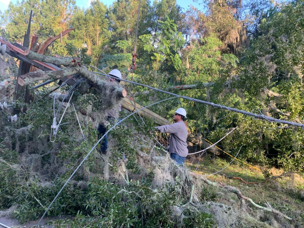 Photo cutline #2: KPUB lineman Eric Hancock restoring power on September 29 in Moultrie, Georgia, in the aftermath of Hurricane Helene’s damages.