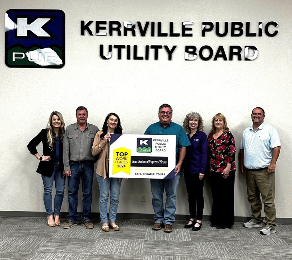 Members of KPUB’s management team are pictured together for the utility company’s 2024 Top Workplaces Award announcement.