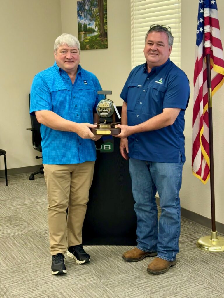 Outgoing trustee Bill Thomas (left) is presented with a commemorative meter lamp by KPUB General Manager and CEO Mike Wittler (right) in recognition of his 10 years of service at the April 15 board meeting.